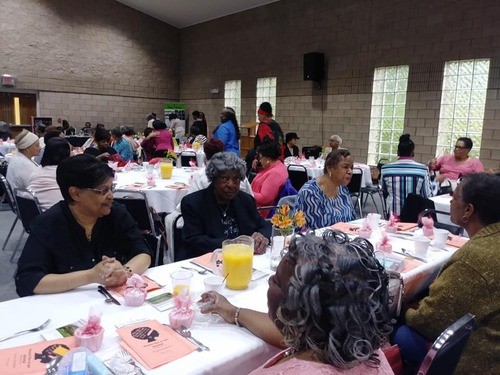 Members eating at community event