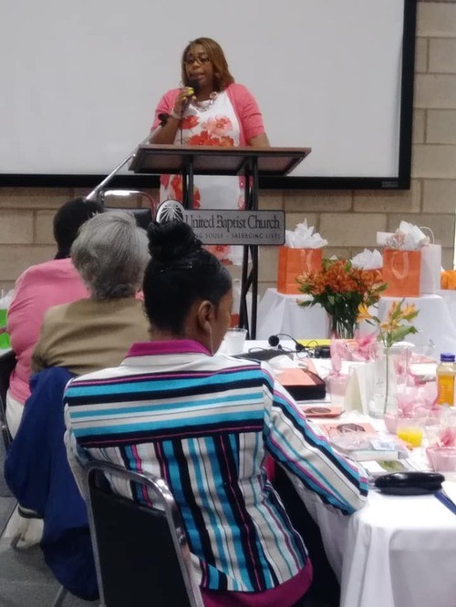 Member speaking a women's event