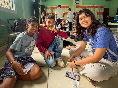 Angela talking with two Honduran boys