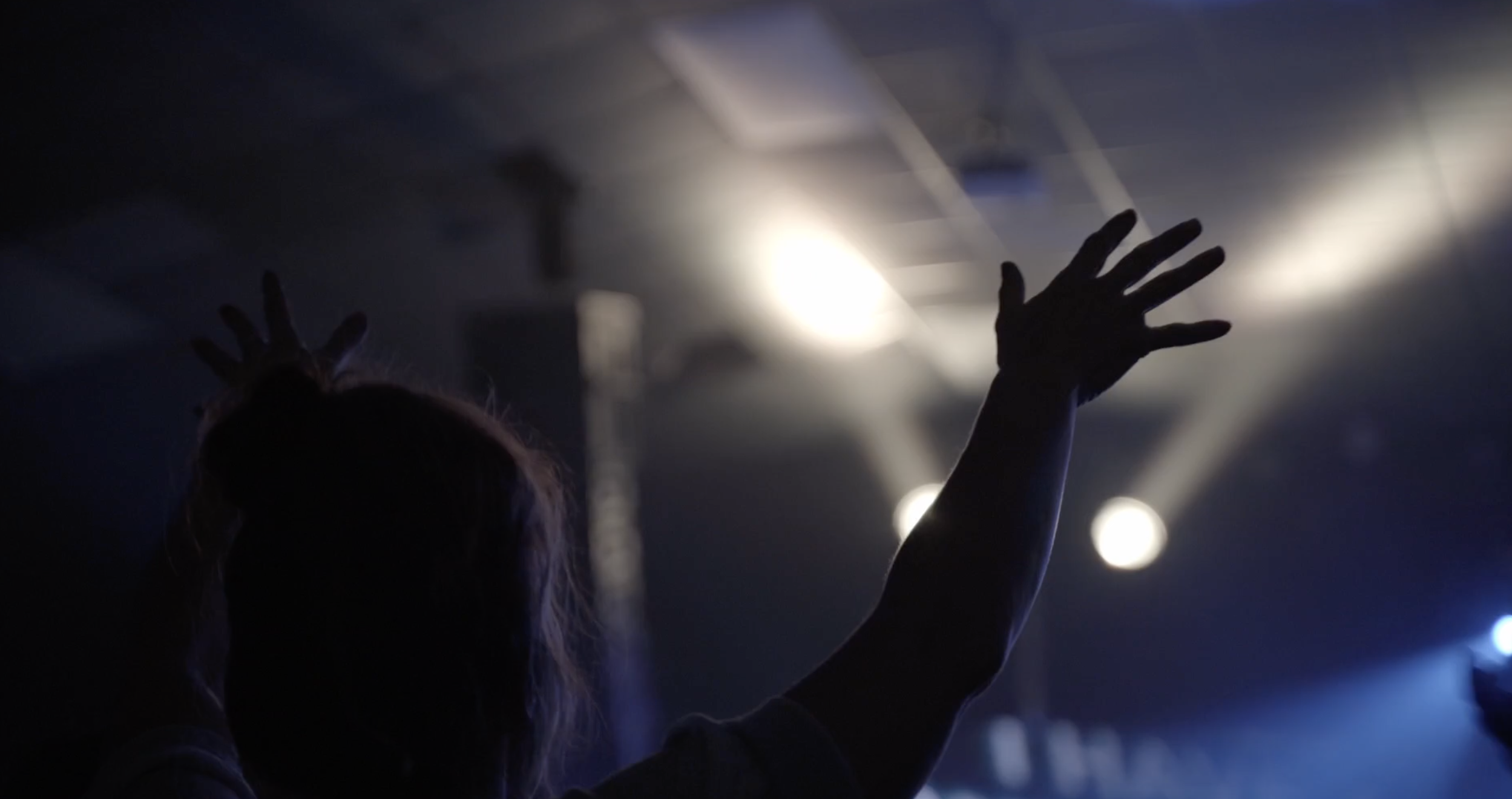 A student worshiping at Takeover