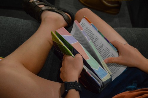 A middle-school boy flips his youth Bible open during Sunday school