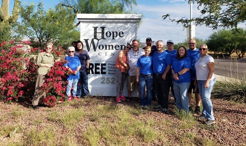 group of people in front of sign for Hope Women's Center