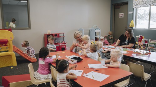Parents and kids at check-in for kids ministry at Canyon View Church
