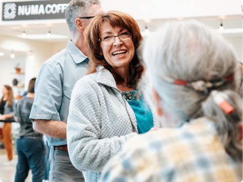 A couple smiling together in the lobby at Canyon View Church