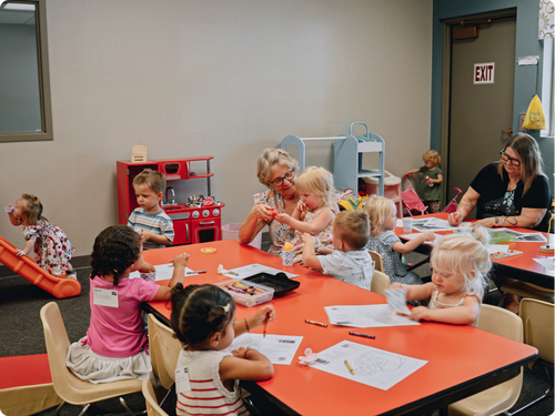 Parents and kids at check-in for kids ministry at Canyon View Church