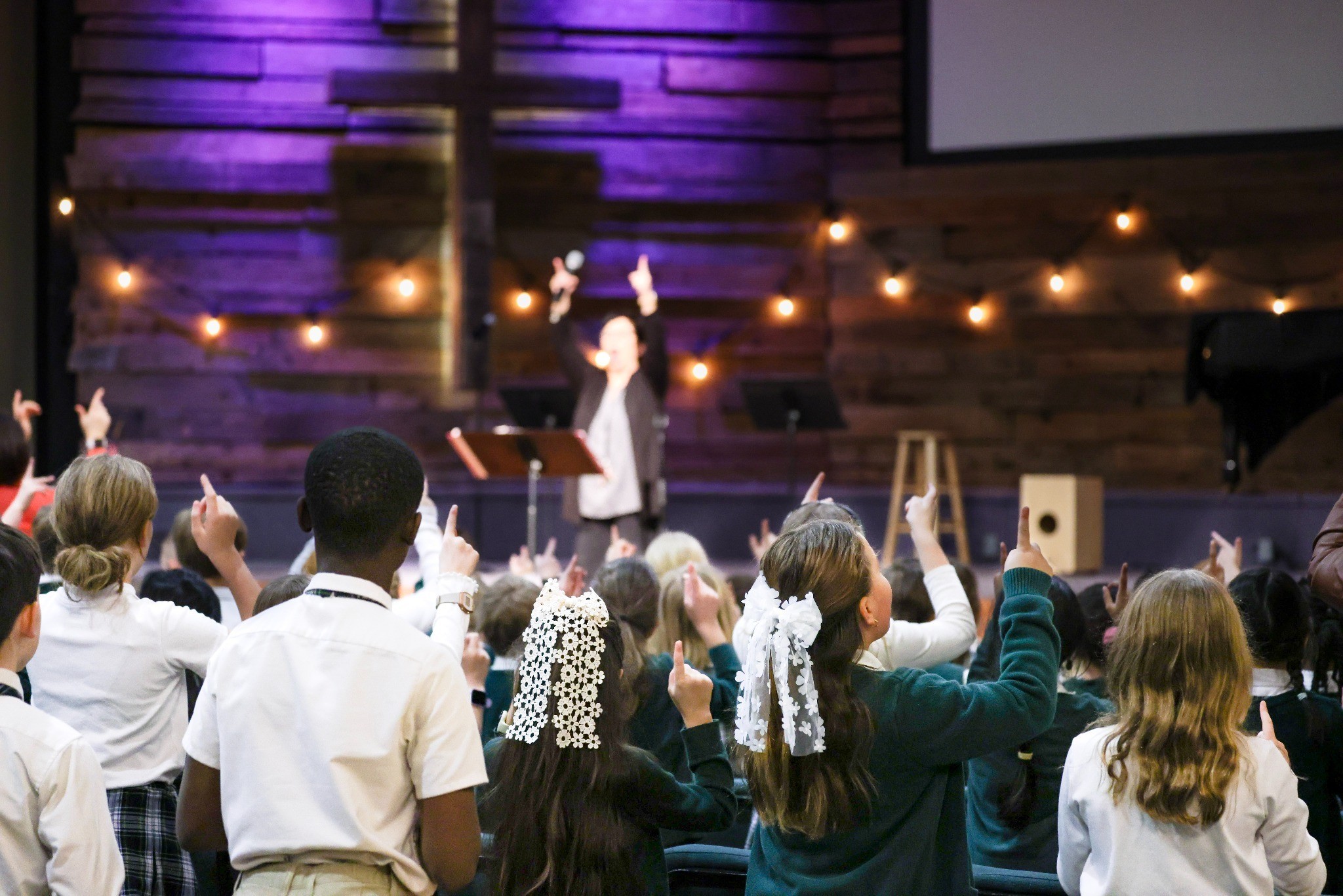 HCA elementary students actively participating in chapel