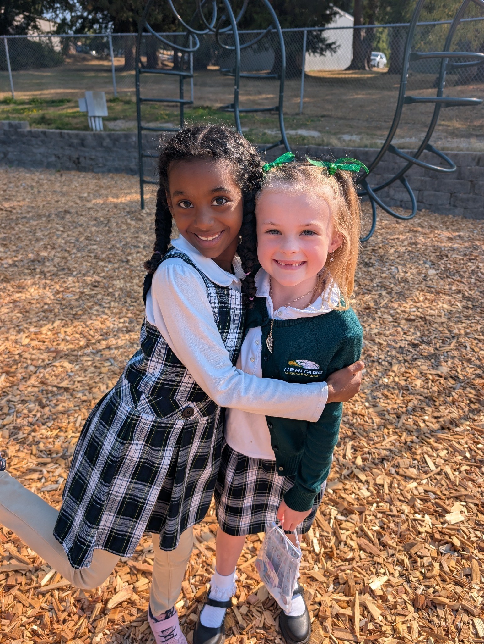 Two Heritage students sharing a joyful moment together