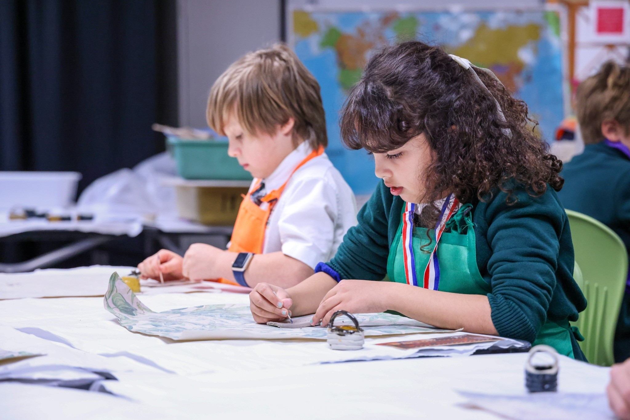 Heritage students engaged in a hands-on art project in the classroom