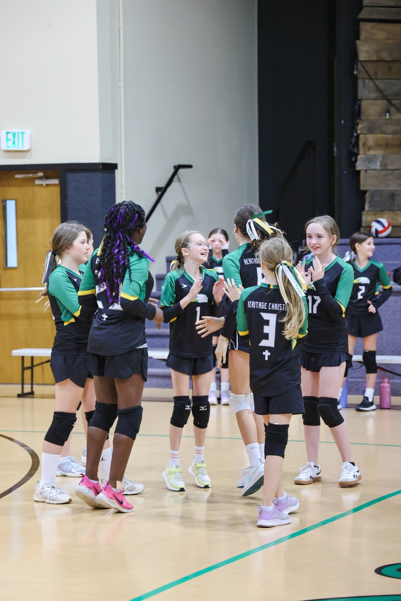 HCA volleyball teammates celebrating together