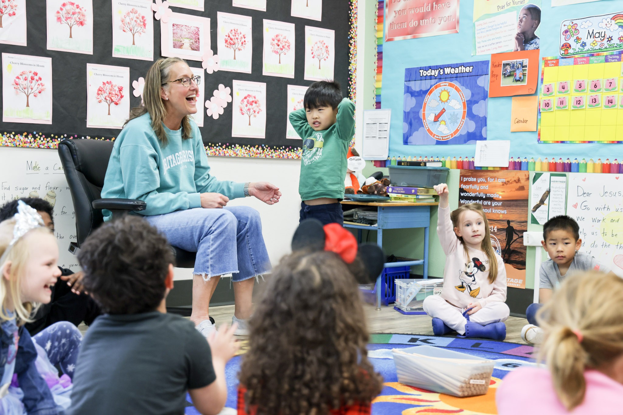 Authentic HCA Kindergarten Bridge classroom photo of children learning with their teacher