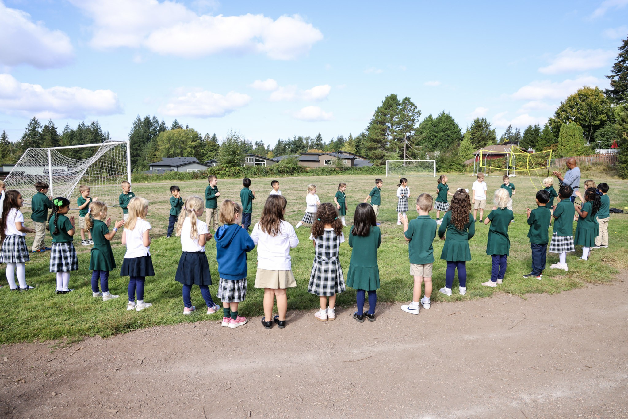 Kindergarten students participating in outdoor physical education