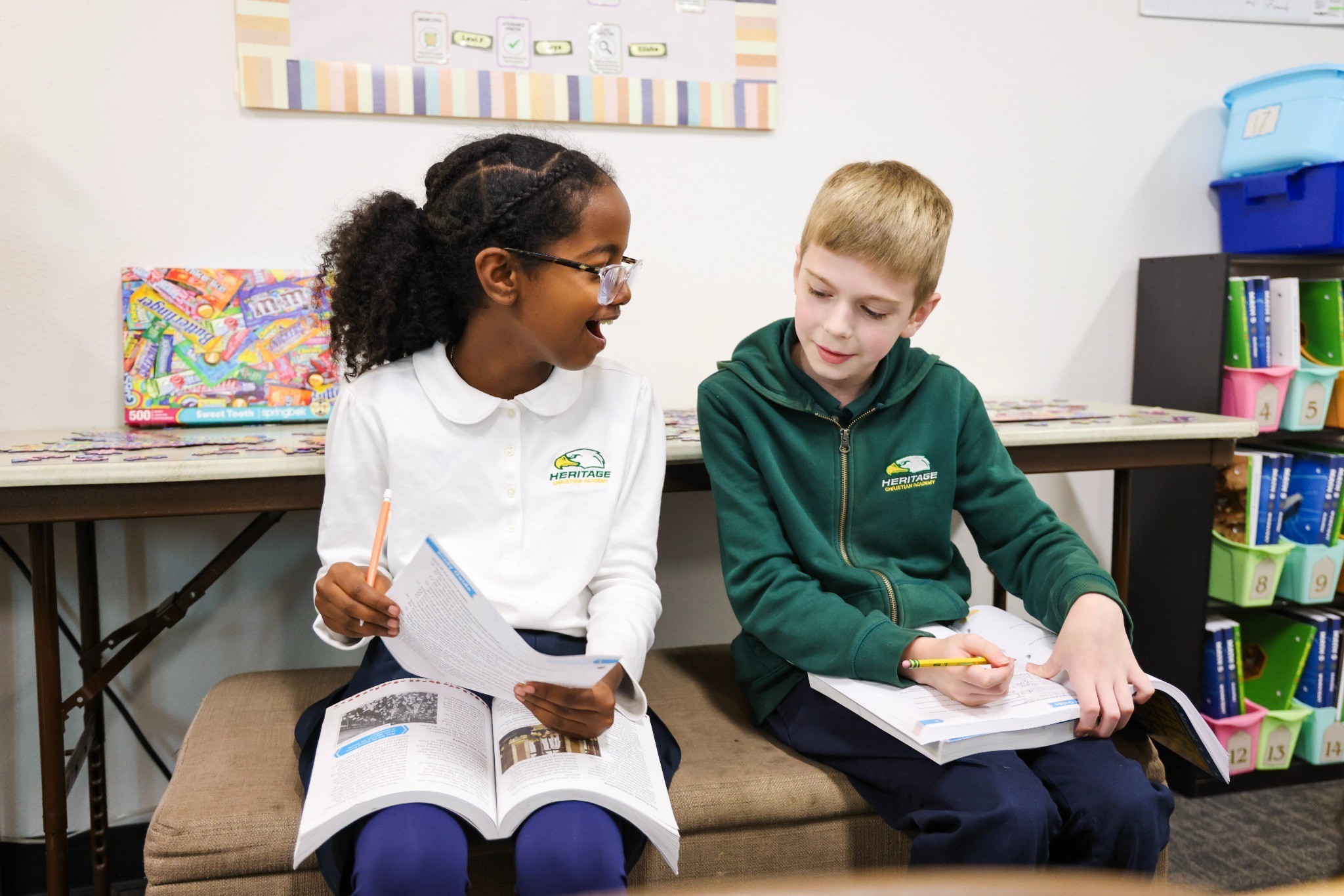 Two Heritage elementary classmates learning and smiling together