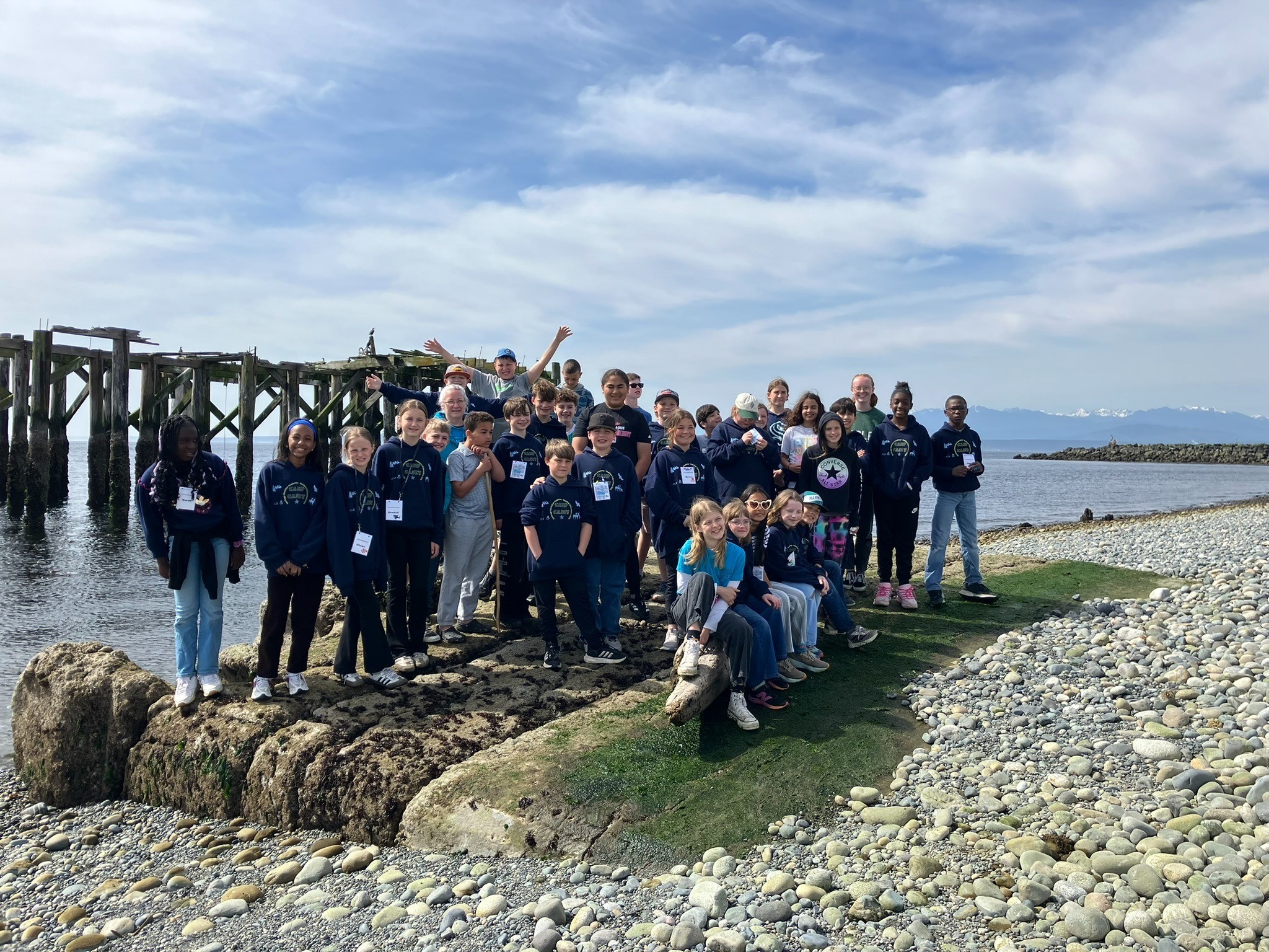 Fifth-grade students together at Camp Casey by the water