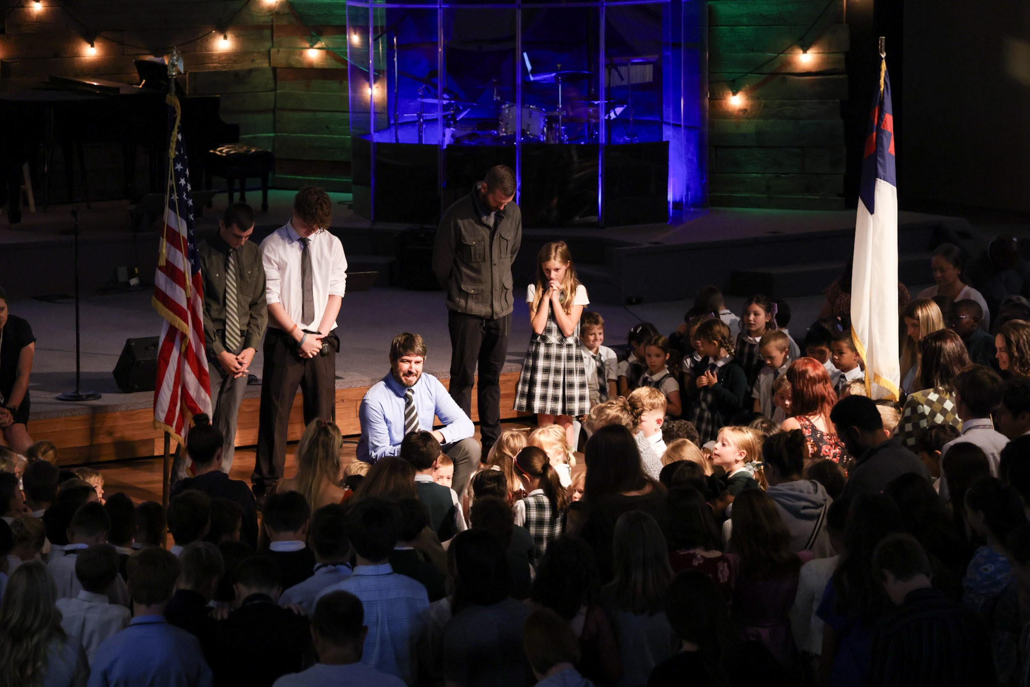 Heritage Christian Academy students and teachers gathered in prayer during chapel