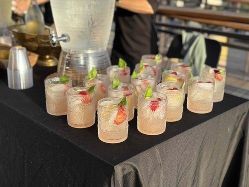 Fresh strawberry and lime drinks lined up for welcome hour