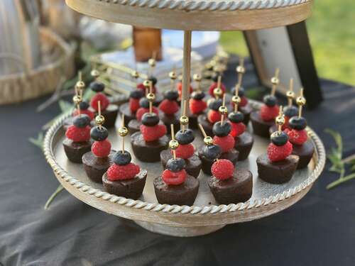 Berry-topped desserts arranged for guests