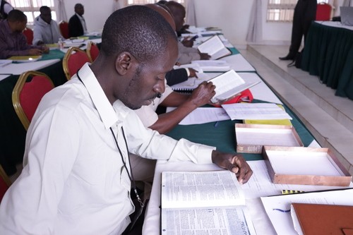 African man studying the Bible