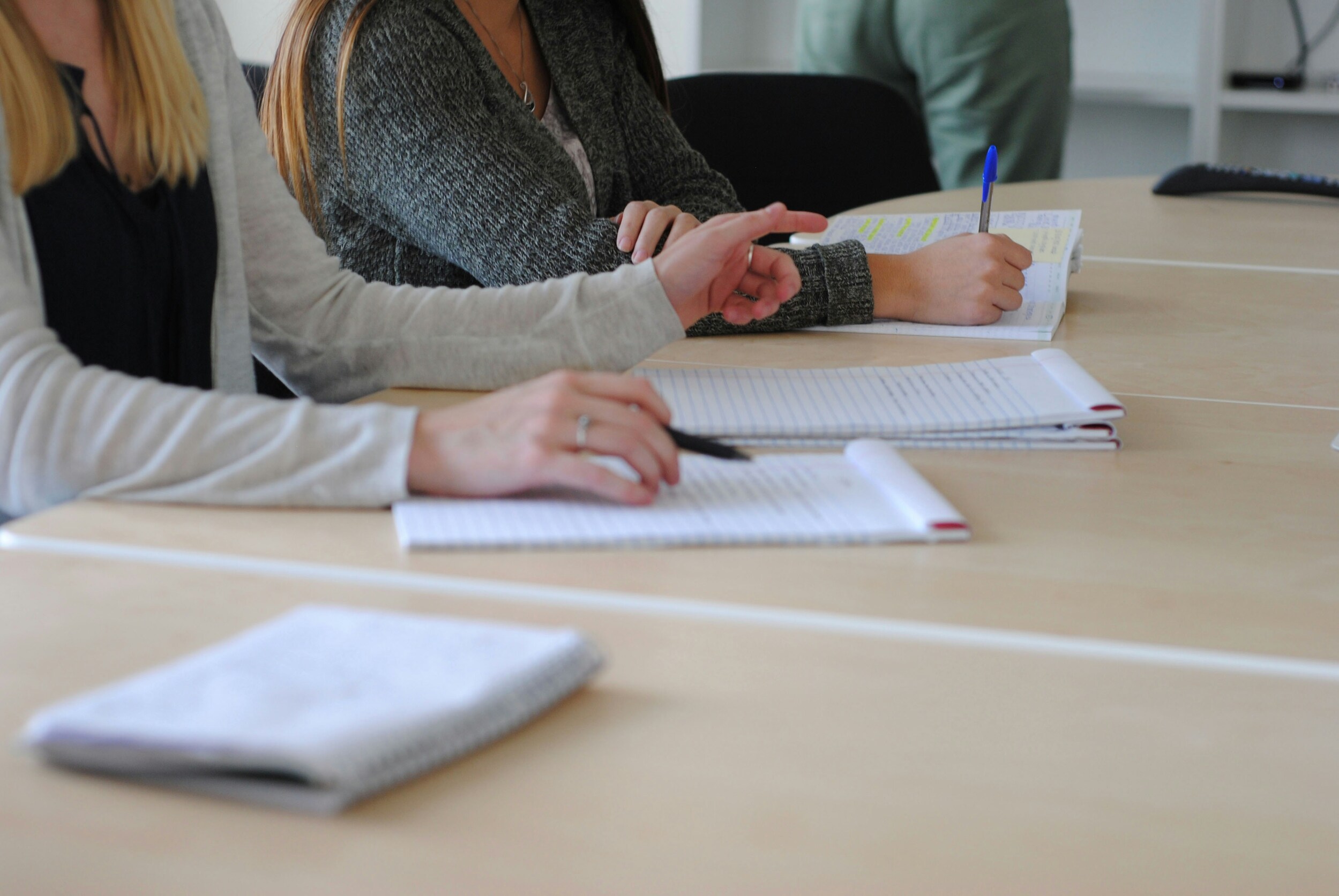 Adults learning together around a table