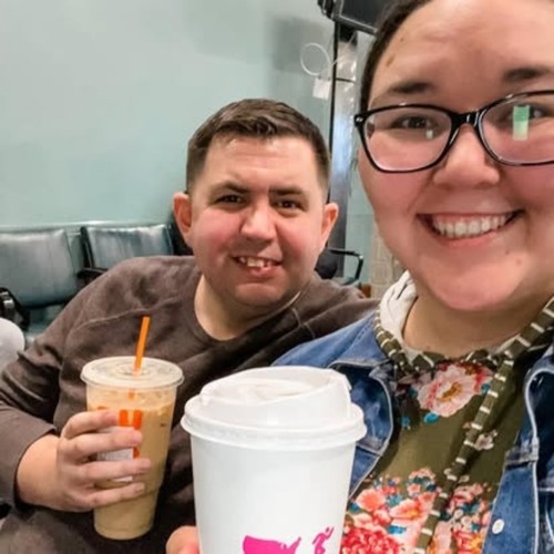 Pastors Josh and Holly Smith sitting and drinking coffee