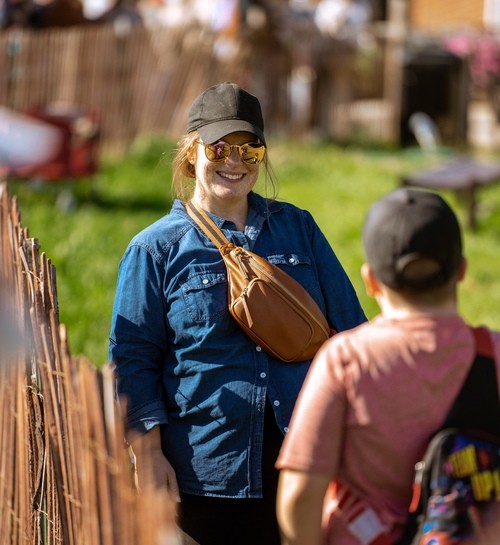woman wearing sunglasses and hat smiling