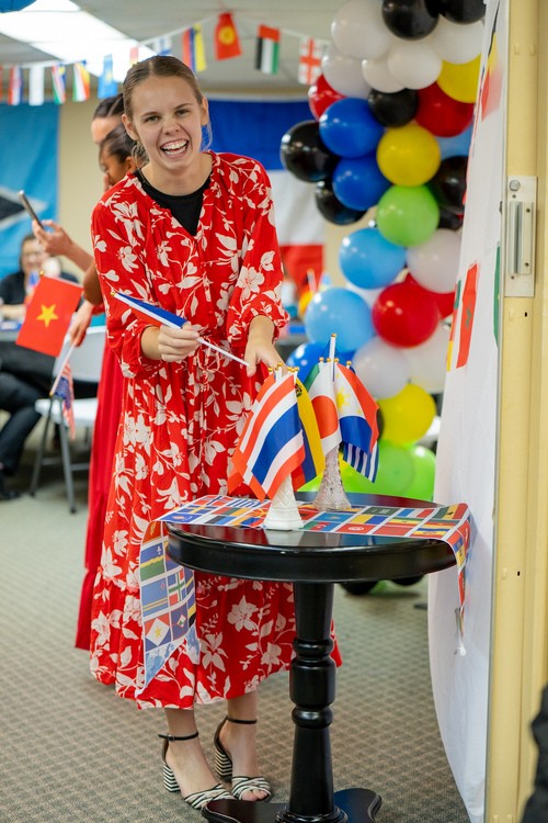 kids on slide, girl going down slide smiling
