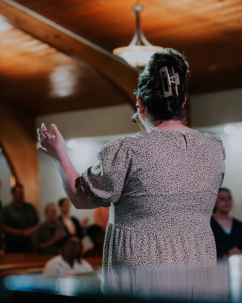 two older ladies are smiling and greeting each other