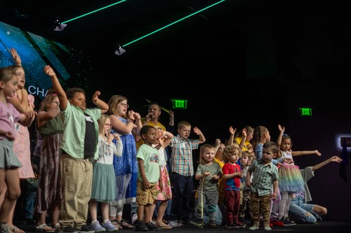 A group of children standing for a photo at One Hope Kids, a ministry of One Hope Church. 