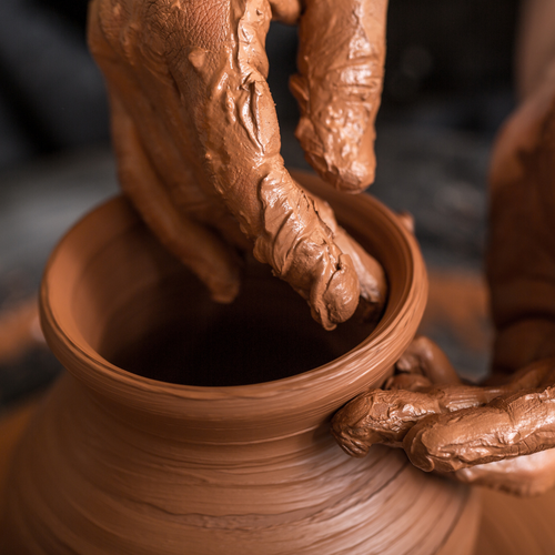 Man making clay pot