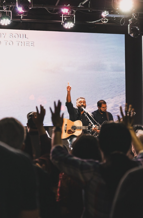 Worship leader at Commission Church in Plano TX leading a powerful spirit-filled worship experience. Non-denominational church in Dallas.