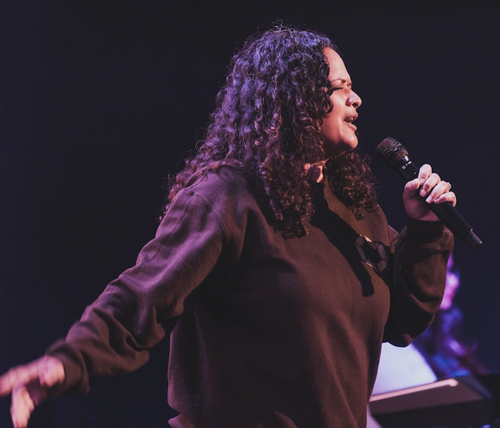 Worship leader passionately singing at Commission Church in Dallas TX - Spirit Filled Church service