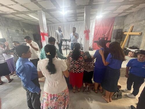 Prayer and fellowship at a Spirit Filled Church service by Commission Church Richardson TX