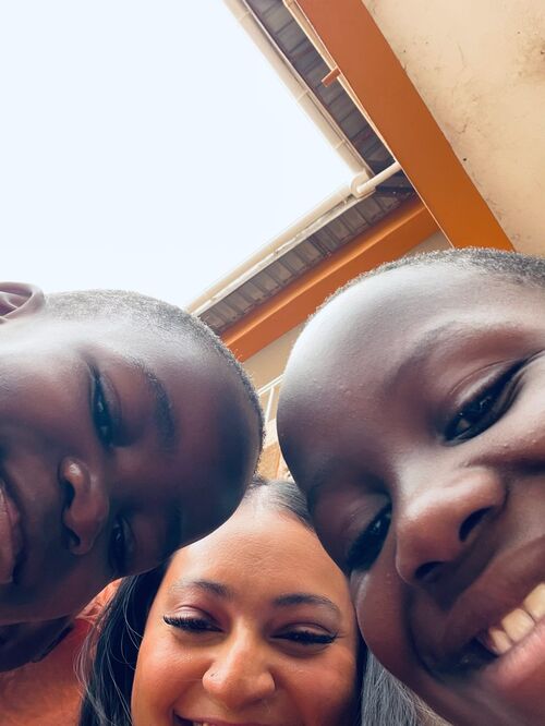 Smiling children and member of Commission Church, Spirit Filled Church in Dallas TX