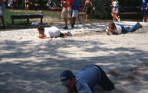 Children racing in the sand.