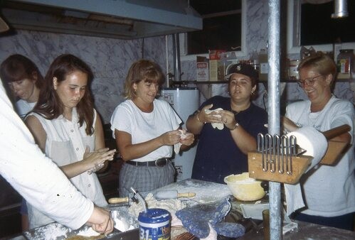 People working in Kitchen together.
