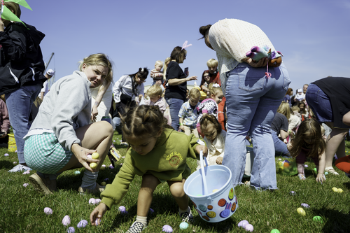 Families enjoy food from a food truck at the annual Egg Hunt at New Life Church in Oak Grove, MO
