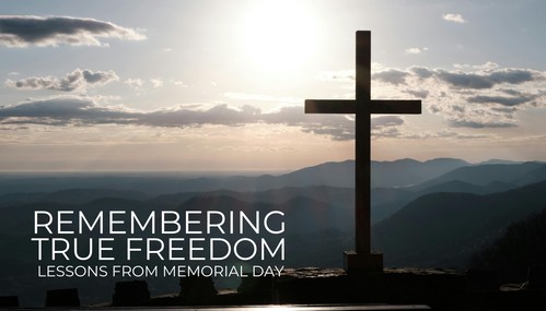 black and white photo of man studying the bible