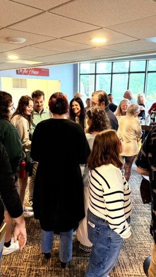 People connecting in the One Church lobby