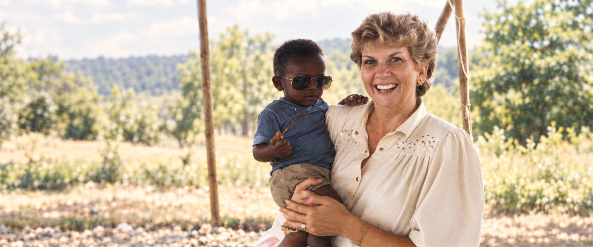 Jackie Mize holding a child