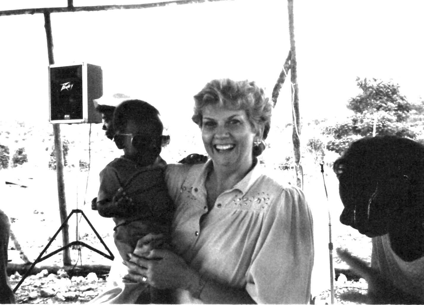 Original photograph of Jackie Mize holding a child