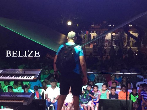 Pastor Chris Pena preaching to a community gathering in Belize.