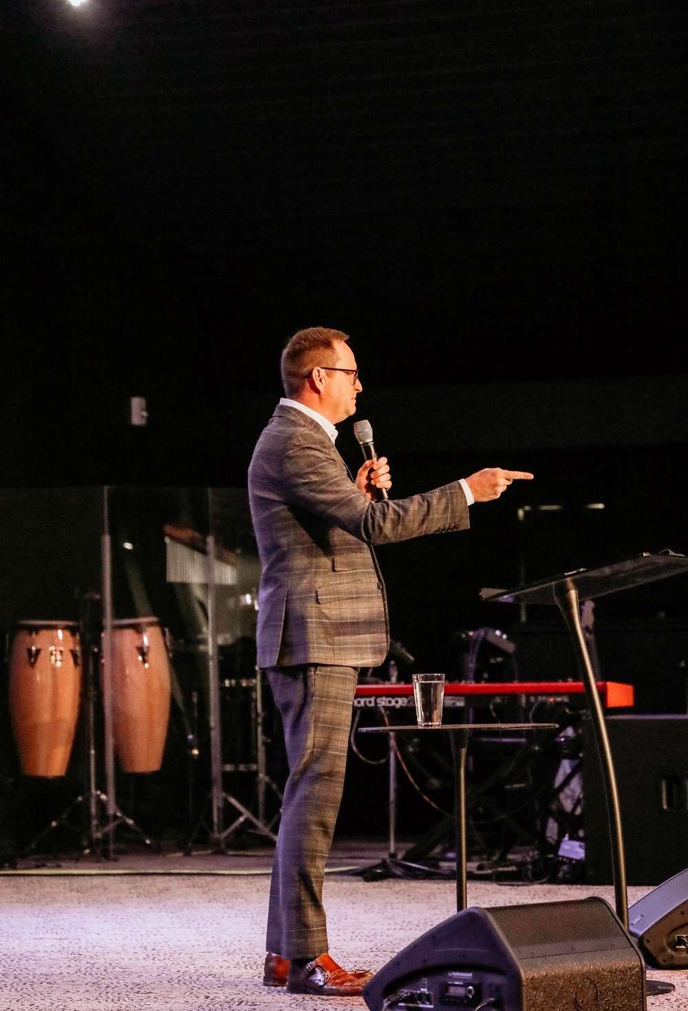 Pastor preaching on stage