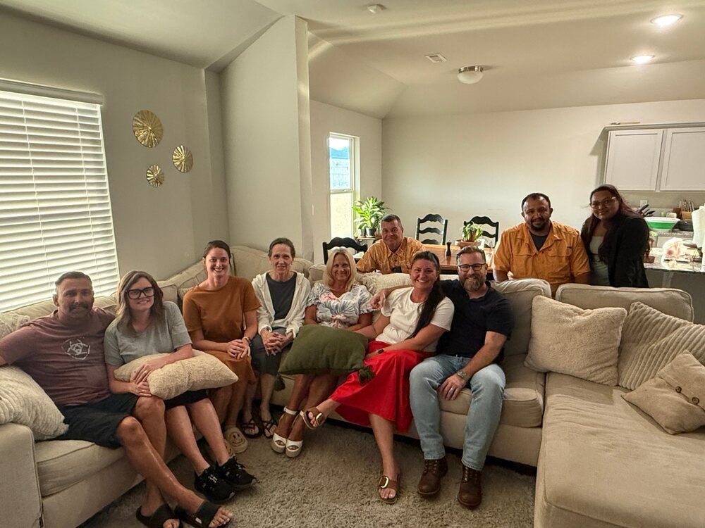 A home group gathered in a living room