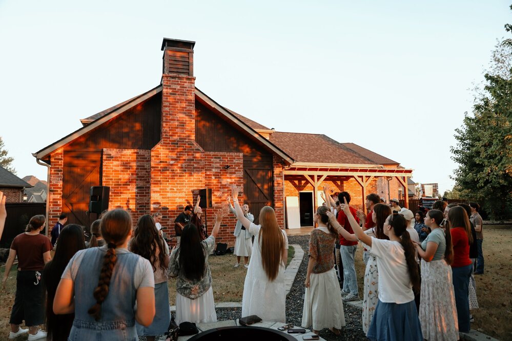 NextGen students worshiping outdoors
