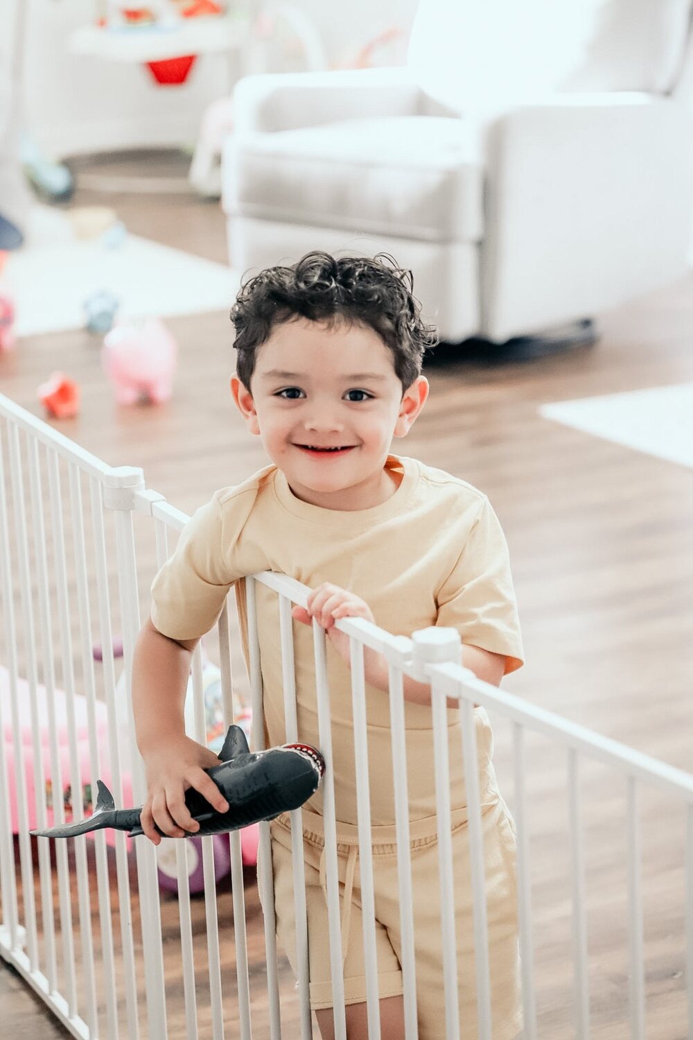 A toddler playing in the nursery