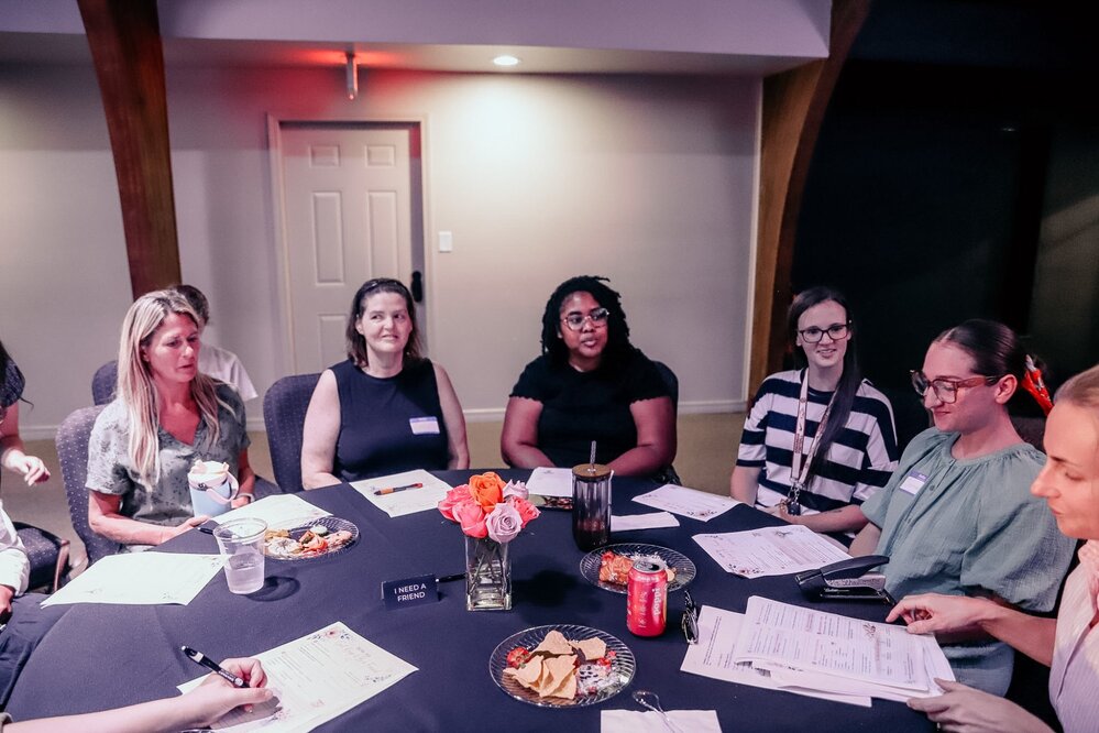 A group talking together around a table