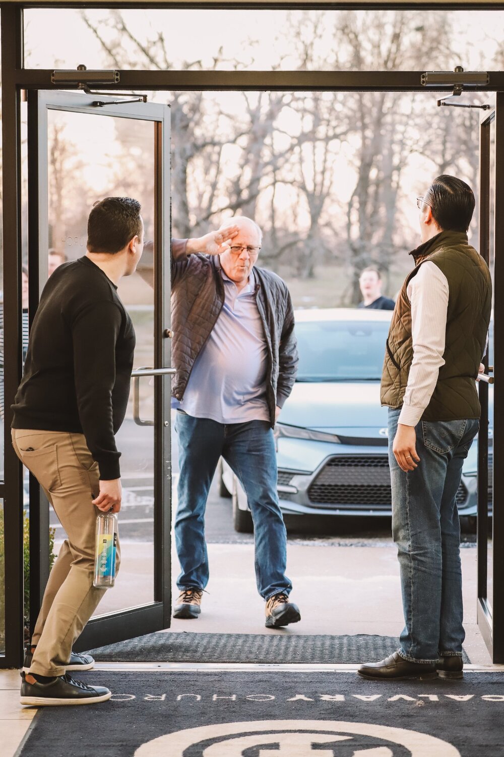 Greeters welcoming people at the door
