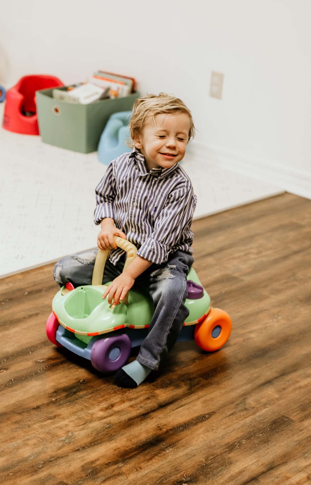 A toddler playing in the nursery