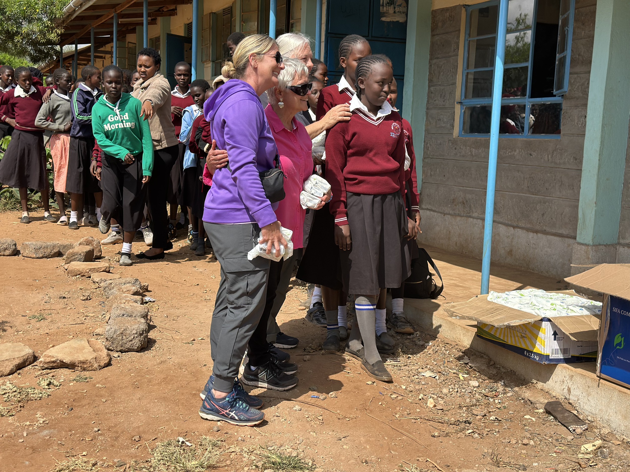 Distributing sanitary towels at Inkati