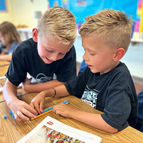 Two boys learning math