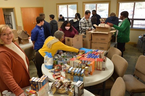 Volunteer packing gift boxes